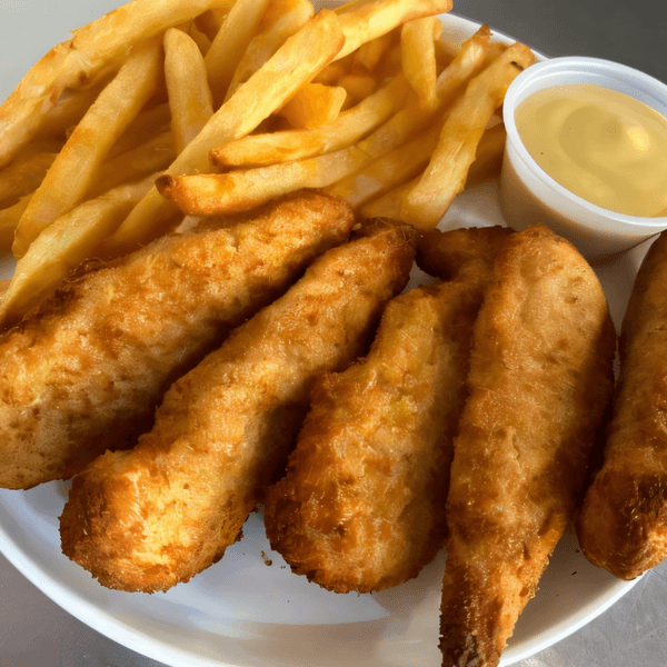 Golden-brown chicken tenders and french fries with a side of honey mustard on a white plate.